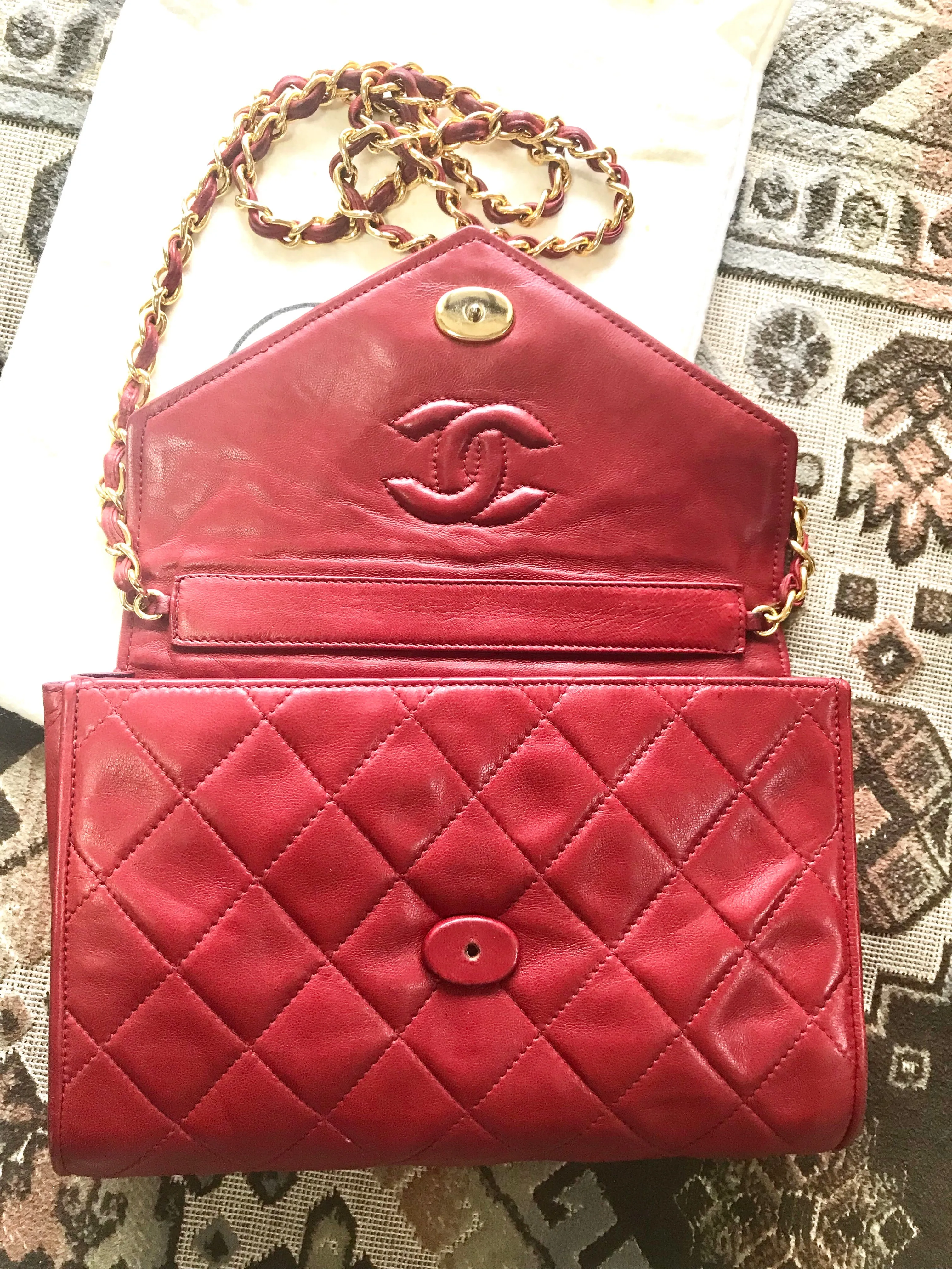 Vintage CHANEL red lamb leather shoulder bag with golden CC button motifs at flap. Rare purse.